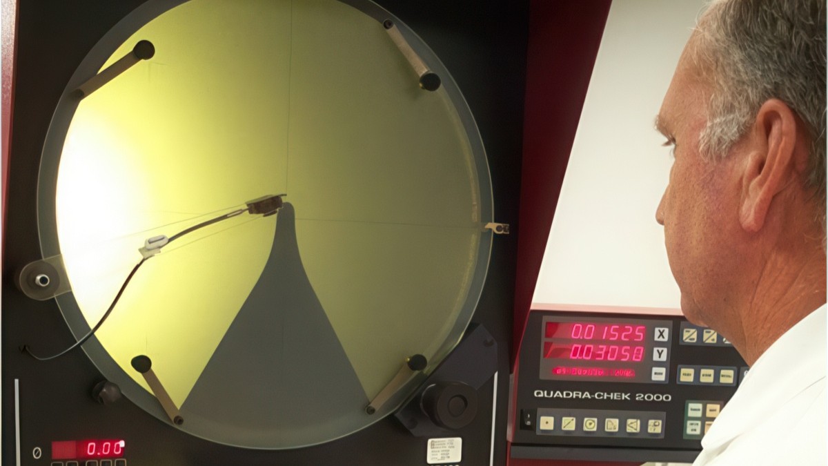 A.I.R. technician using optical comparator